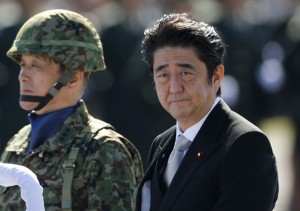 Japan's Prime Minister Shinzo Abe reviews Japan Self-Defence Forces troops in Asaka, Japan