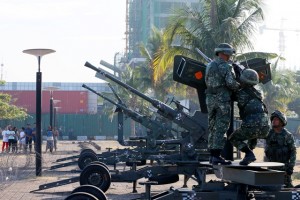 Philippine Marines mount anti-aircraft guns near the venue as security has been tightened leading to next week's APEC (Asia Pacific Economic Cooperation) Summit. Photo by AP/Bullit Marquez