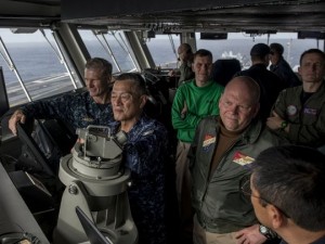 Vice Adm. Joseph Aucoin, commander of the 7th Fleet, left, and Vice Adm. Yasuhiro Shigeoka, commander in chief, Japan Self-Defense Fleet Security, center left, and Rear Adm. John Alexander, commander of Battle Force 7th Fleet, right, observe flight operations from the navigation bridge of the U.S. Navy's only forward-deployed aircraft carrier USS Ronald Reagan. (Photo: U.S. Navy)