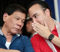 Rodrigo Duterte listens intently to Senator Alan Peter Cayetano during the 23rd AFAD Defense and Sporting Arms Show at the SM Megatrade Hall, SM Megamall on Wednesday, November 11, 2015. INQUIRER PHOTO / GRIG C. MONTEGRANDE