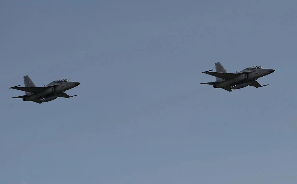 Two newly acquired FA-50PH fighter jets perform a fly-by during the Armed Forces of the Philippines (AFP) 80th anniversary celebration / Getty Images/Noel Celis