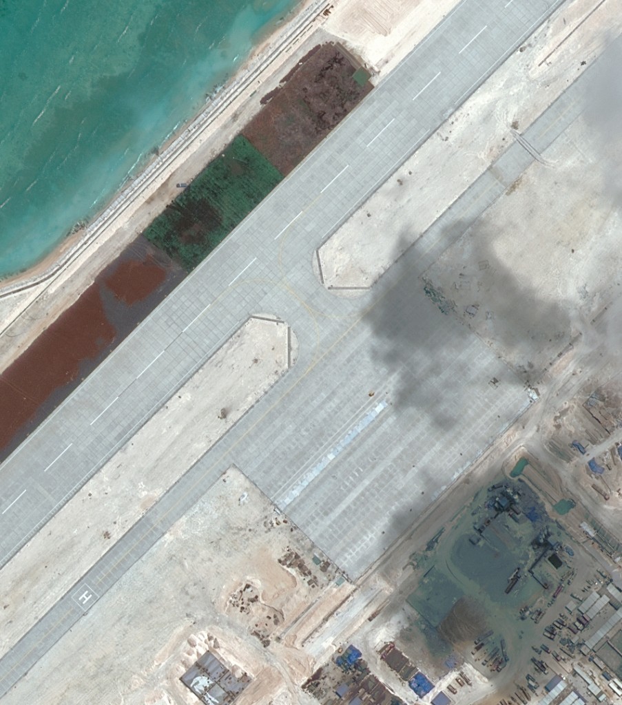 China is in advanced stages of construction on its 3,000 meter airstrip at Fiery Cross Reef. Image source: AMTI