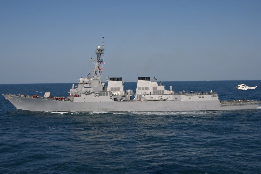 PACIFIC OCEAN (March 26, 2010) The guided-missile destroyer USS Lassen (DDG 82) receives a helicopter from the Military Sealift Command fleet replenishment oiler USNS Carl Brashear (T-AKE-7) during a vertical replenishment conducted off the starboard side of guided-missile destroyer USS Curtis Wilbur (DDG 54). (U.S. Navy photo by Mass Communication Specialist 2nd Class Byron C. Linder)