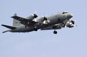 A Japan Maritime Self-Defense Force (JMSDF) P-3C Orion flies above the aircraft carrier USS Kitty Hawk (CV 63) during a 19-ship group photo exercise. File:US Navy 